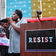 Transgender Army veteran Tanya Walker speaks to protesters in Times Square near a military recruitment center as they show their anger at President Donald Trump’s decision to reinstate a ban on transgender individuals from serving in the military on July 26, 2017 in New York City. Trump citied the ‘tremendous medical costs and disruption’ for his decision.